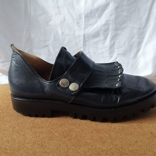 Women's black leather loafers with tassels and snap buttons, size 37