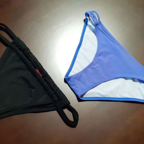 Two women's swimsuits new, one blue and one black, sizes XS and S
