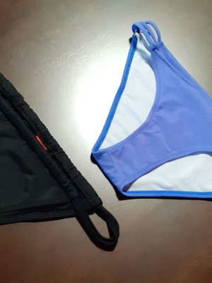 Two women's swimsuits new, one blue and one black, sizes XS and S