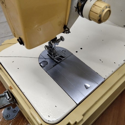 Singer sewing machine used, portable with frame damages
