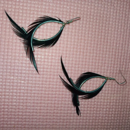 Fallen Angel earrings like new with black hanging feathers