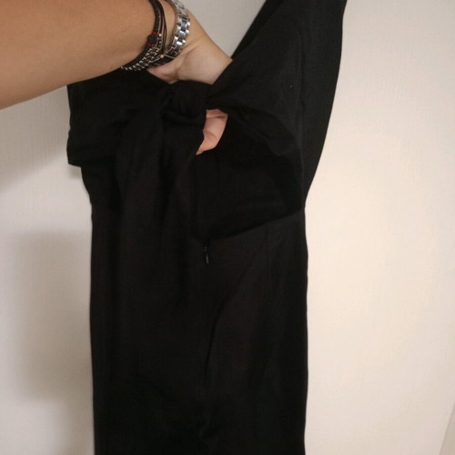 Black one-piece jumpsuit like new, deep neckline and back tie, size S
