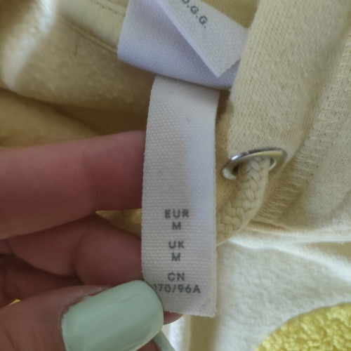 H&M sweatshirt used, yellow, size M with small stain