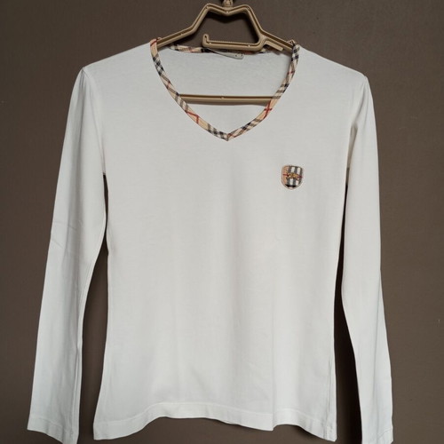 White women's long-sleeve blouse with classic checkered trim, like new
