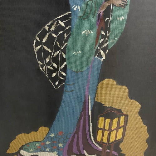 Textile painting with embroidered design used