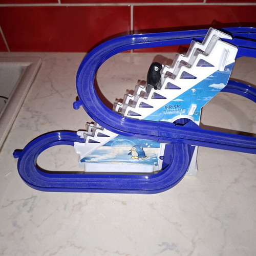Penguin climbing stairs used toy
