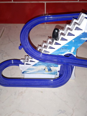 Penguin climbing stairs used toy