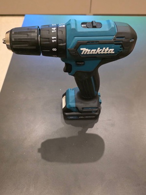 Makita HP333D impact drill driver set with 2 batteries and charger
