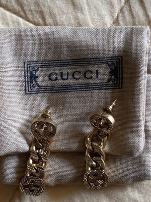 Gucci earrings like new, gold color