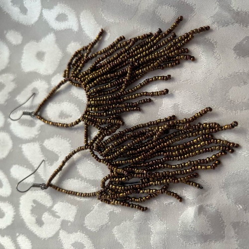 Earrings long with bead strands used