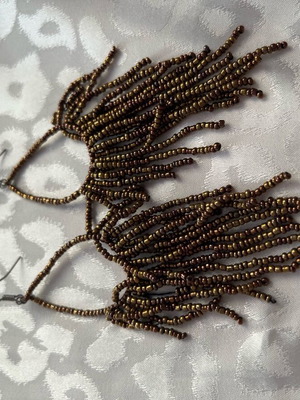 Earrings long with bead strands used