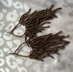 Earrings long with bead strands used