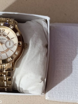 Daniel Klein wristwatch like new, gold bracelet, women's