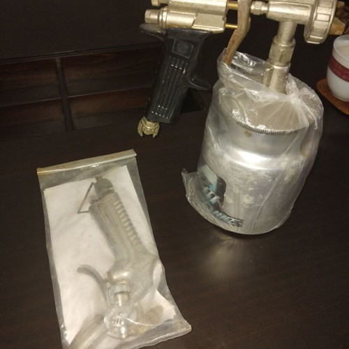 Paint spray gun with container used, professional