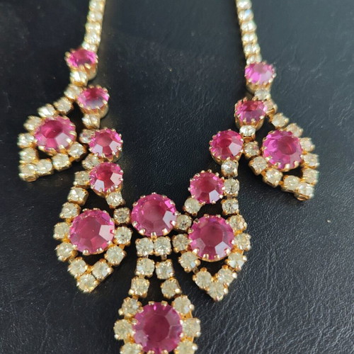 Antique necklace used with pink stones and gold rhinestones