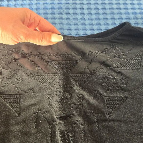 Black blouse with subtle chest design, size Large/Extra Large
