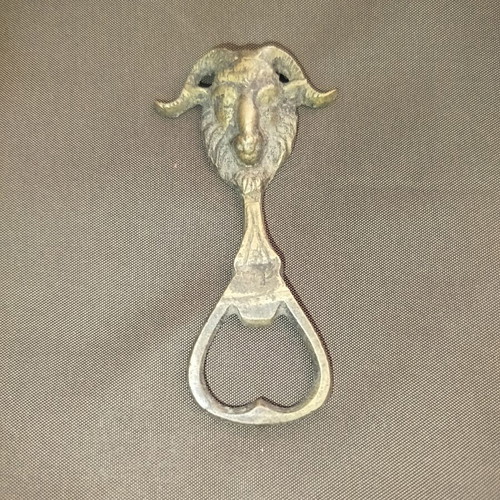 Bronze bottle opener used
