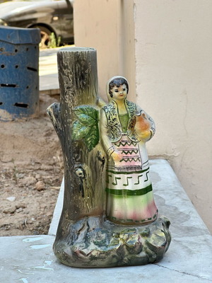Vintage ceramic decorative vase used with peasant woman and jug design