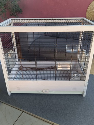 Wooden birdcage used with steel bars and plastic door