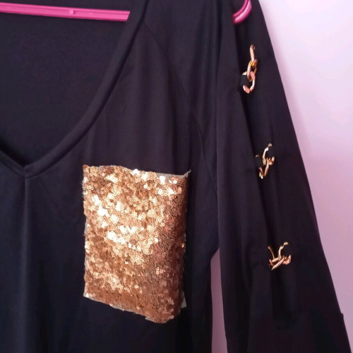 Black elastic blouse with sequin pocket and cutout, like new