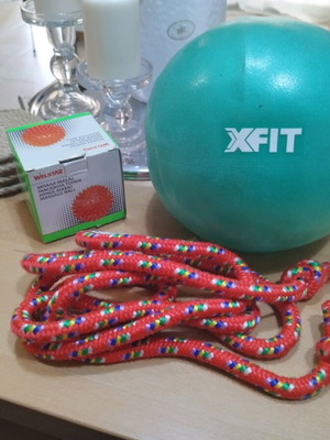 Package with 1 X-FIT Mini Pilates Ball, 1 massage ball, and 1 jump rope.