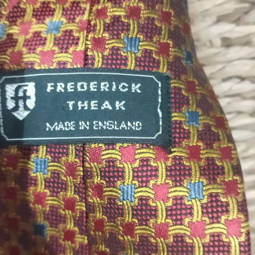 Frederick Theak silk tie like new, multicolored orange