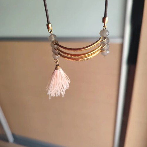Long necklace with brown leather and motif like new