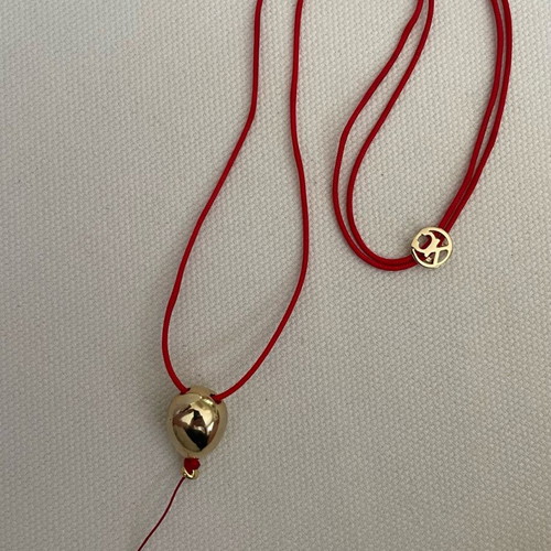 Kessaris necklace used with gold-plated balloon-shaped pendant