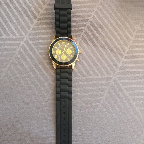 Women's black watch like new with rubber and steel