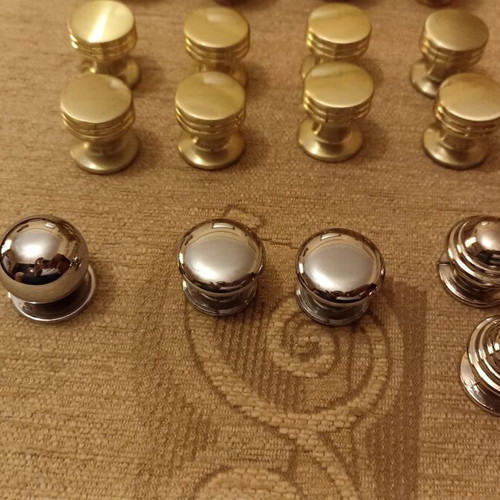 Handles and knobs for cabinets and drawers used, 24 pieces gold and silver