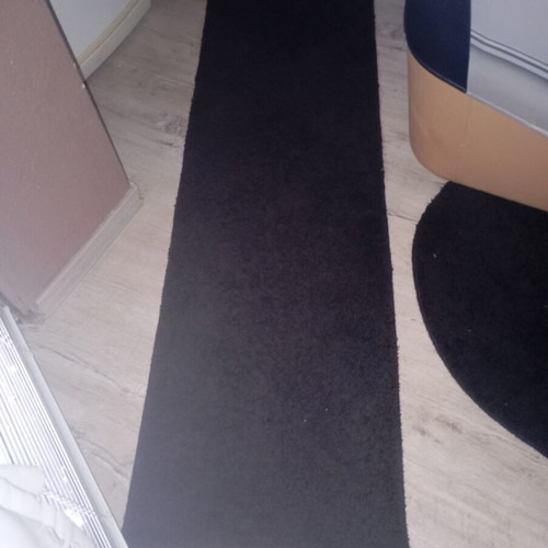 Black interior vintage runner rug used, minimalist design