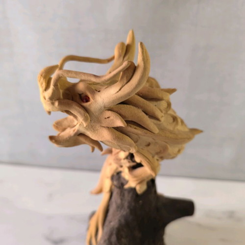 Wooden handmade dragon used with wooden base