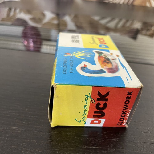 Tin duck vintage toy used with original box, Chinese made