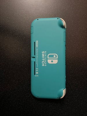 Nintendo Switch Lite turquoise like new, 32 GB, charger included