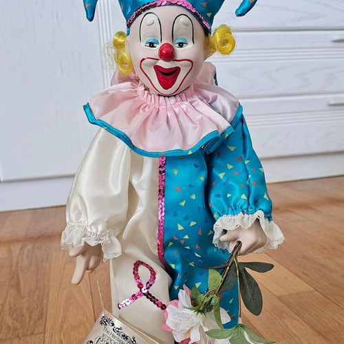 Heritage Mint porcelain doll like new with stand