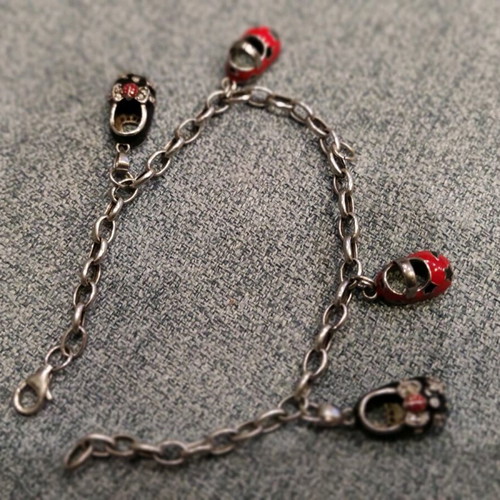 Silver 925 chain with 4 baby shoes used