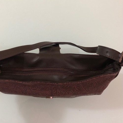 Women's brown shoulder bag used with embossed design