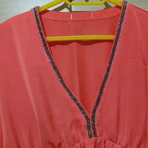 Coral satin-like blouse with V and rhinestones like new, size Medium