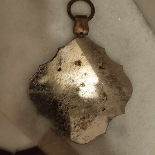 Metal pendant used with Virgin Mary and baby Jesus for car