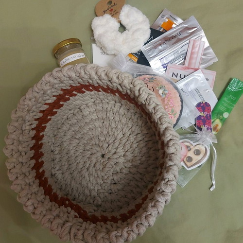 Knitted basket like new with gifts made of macrame cord