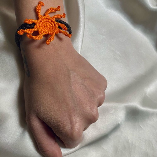 Macrame bracelet like new with adjustable fastening, black and orange
