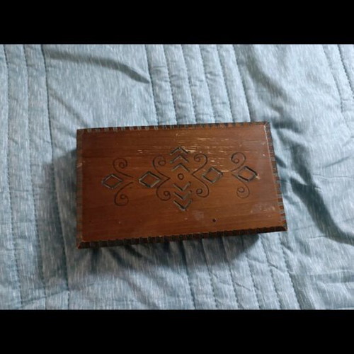Vintage wooden box used with carved patterns
