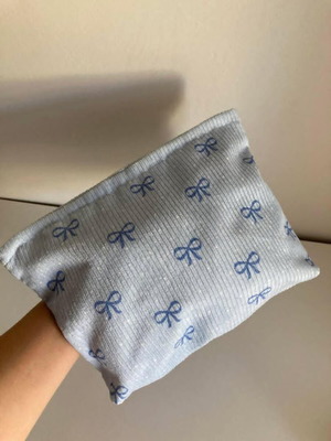 Toiletry bag like new with blue bow pattern