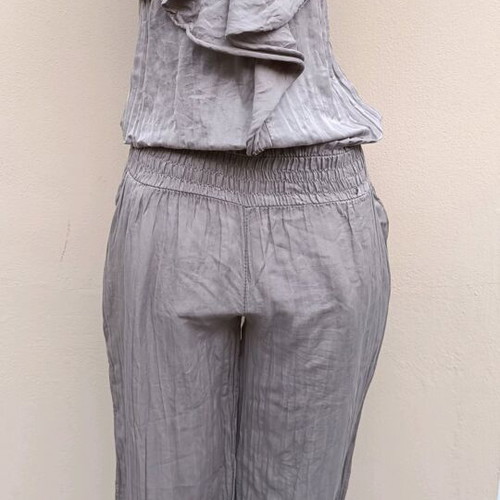Strapless jumpsuit used, gray brown with bow and ruffles
