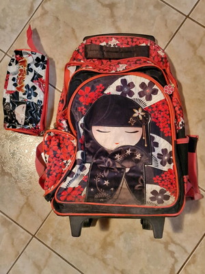 School bag used with wheels and matching pencil case