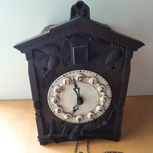 Vintage cuckoo clock used with pinecone weights