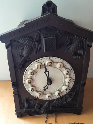 Vintage cuckoo clock used with pinecone weights