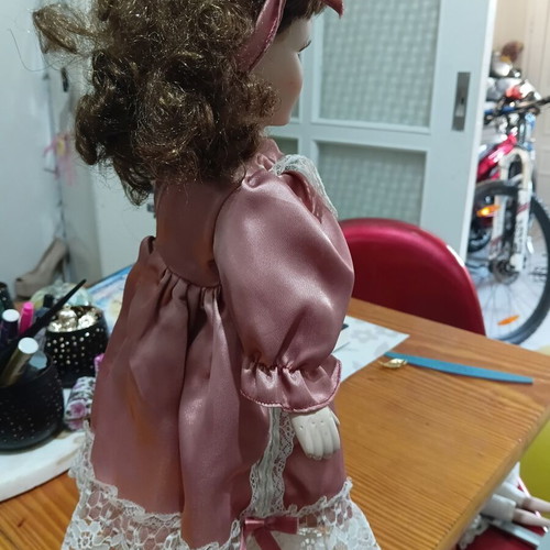 Porcelain doll used with cracked forehead from fall