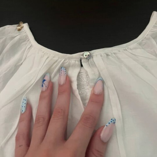 White blouse with gold details