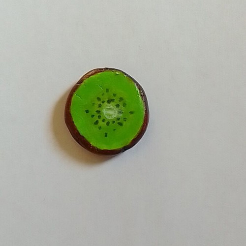 Handmade kiwi fruit magnet from clay